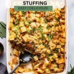 the best vegetarian stuffing in baking dish garnished with chopped parsley.